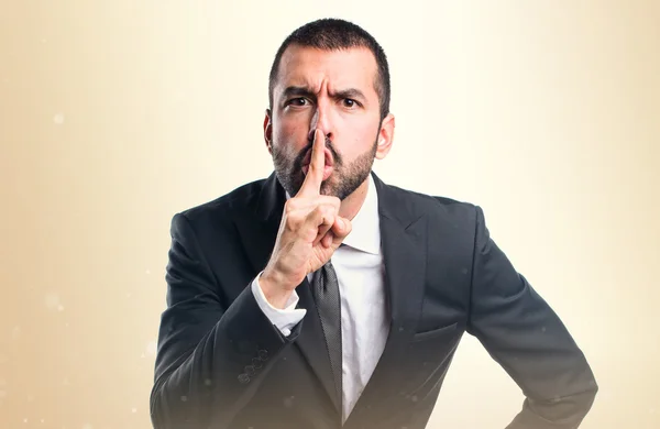 Businessman making silence gesture — Stock Photo, Image