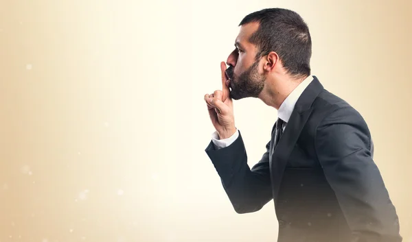 Businessman making silence gesture — Stock Photo, Image