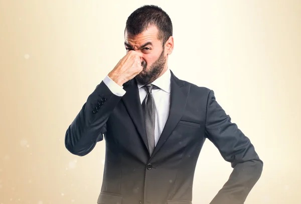 Biznesmen Dokonywanie pachnący zły gest — Zdjęcie stockowe