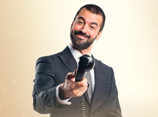 Empresario haciendo gesto telefónico — Foto de Stock