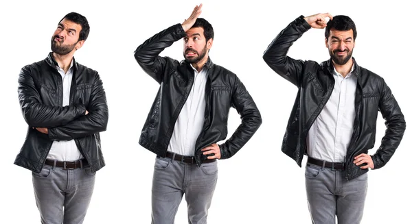 Man with leather jacket having doubts — Stock Photo, Image