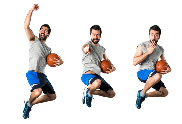 Man playing basketball and pointing to the front — Stock Photo, Image