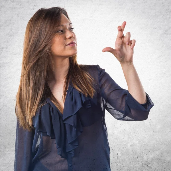 Young girl with her fingers crossing — Stock Photo, Image