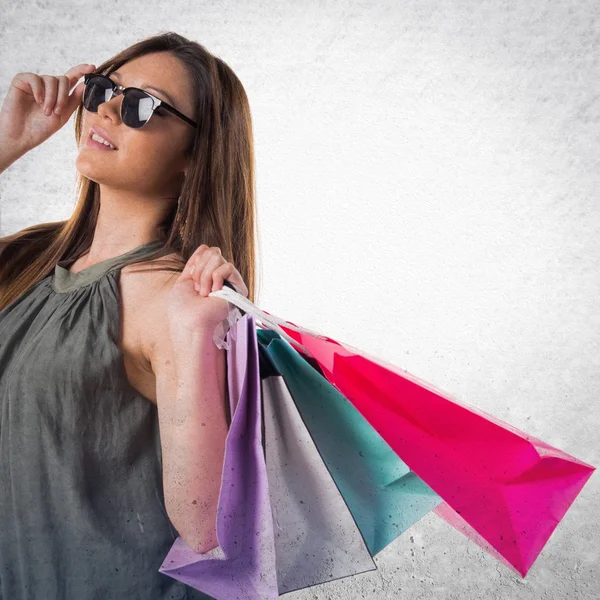 Woman with many shopping bags — Stock Photo, Image