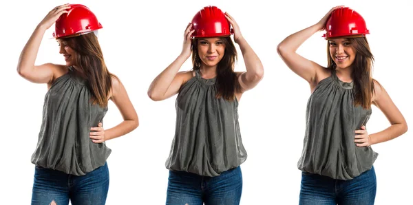 Unga arbetstagare kvinna med röd hatt — Stockfoto