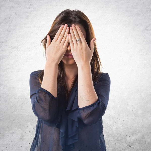 Young girl covering her eyes — Stock Photo, Image