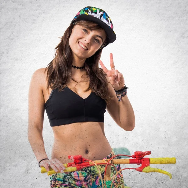 Young girl with colorful bike — Stock Photo, Image