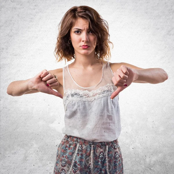 Woman doing bad signal — Stock Photo, Image