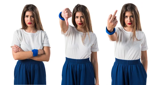 Young girl doing bad signal — Stock Photo, Image