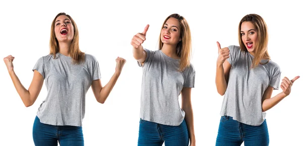 Young girl with thumb up — Stock Photo, Image