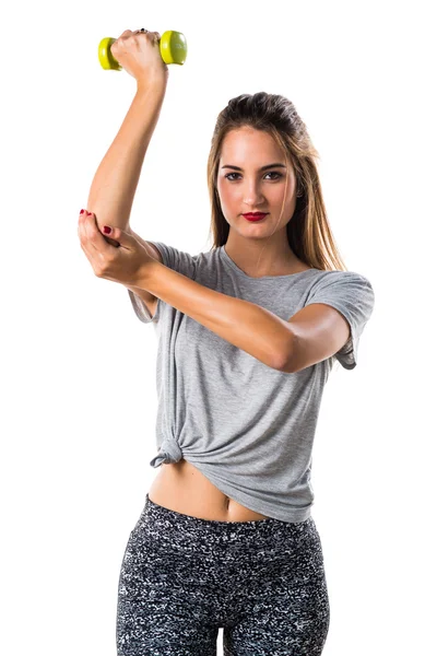 Giovane donna che fa sollevamento pesi — Foto Stock
