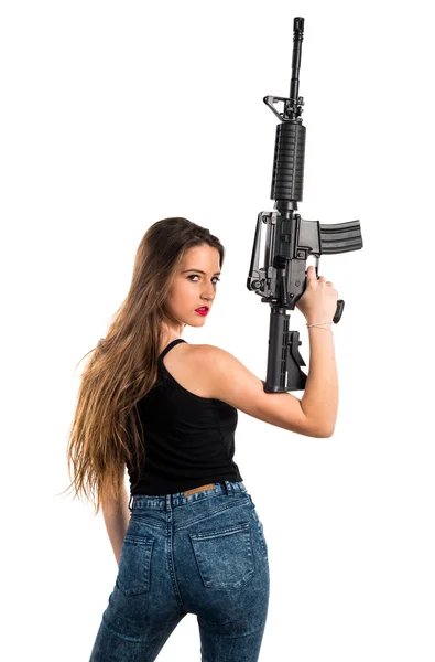 Jovencita sosteniendo un rifle — Foto de Stock