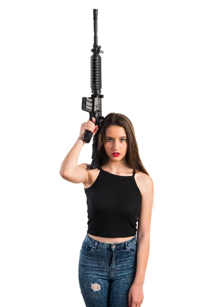 Jovencita sosteniendo un rifle — Foto de Stock