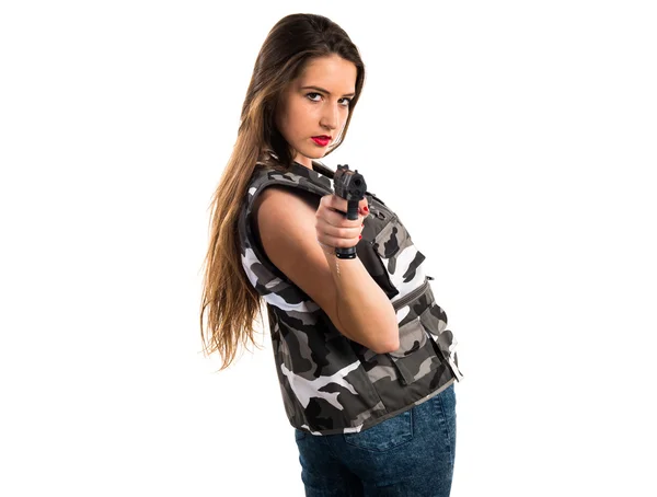 Chica joven sosteniendo una pistola —  Fotos de Stock