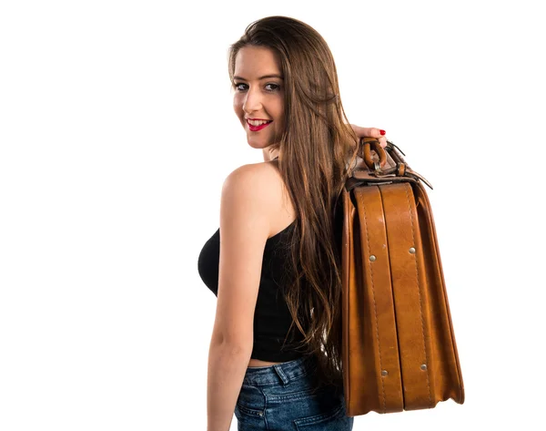 Chica joven sosteniendo un maletín — Foto de Stock