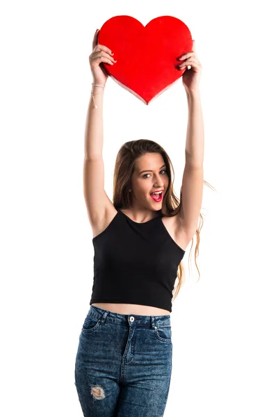 Chica joven sosteniendo un símbolo del corazón —  Fotos de Stock