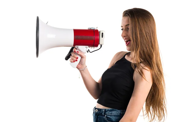 Young girl shouting by megaphone — Stock Photo, Image