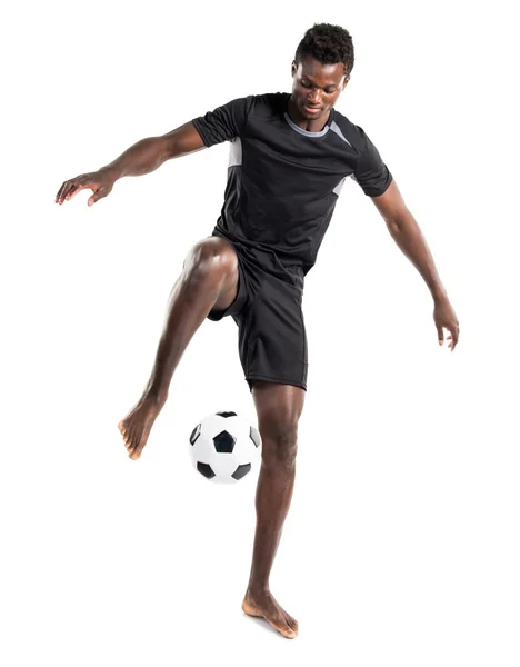 Hombre negro jugando al fútbol — Foto de Stock