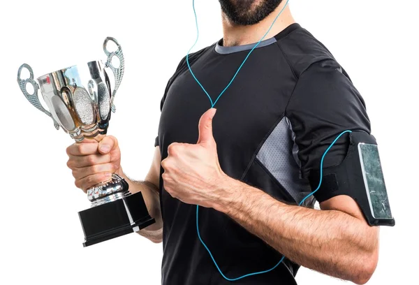Sportman segurando um troféu — Fotografia de Stock