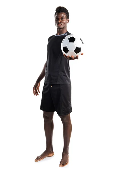 Homem negro jogando futebol — Fotografia de Stock