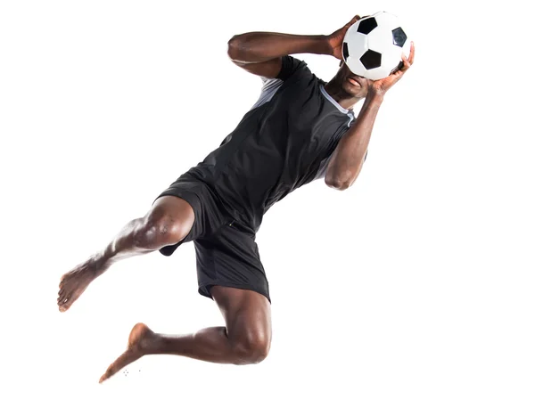 Hombre negro jugando al fútbol — Foto de Stock