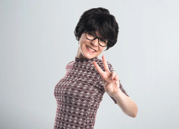 Girl doing victory gesture — Stock Photo, Image