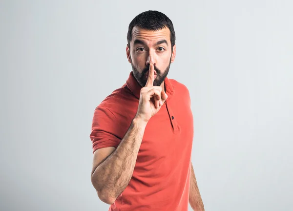 Bonito homem fazendo gesto de silêncio — Fotografia de Stock