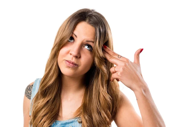 Pretty girl in jumper shorts making suicide gesture — Stock Photo, Image