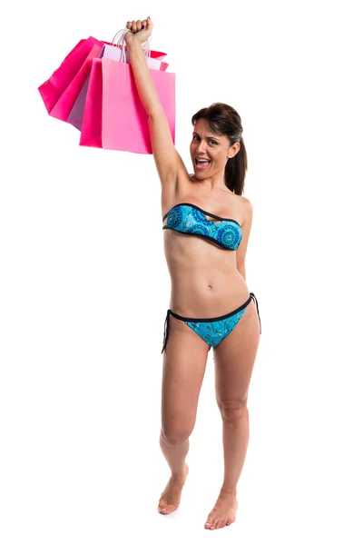 Mujer en bikini con muchas bolsas de compras —  Fotos de Stock