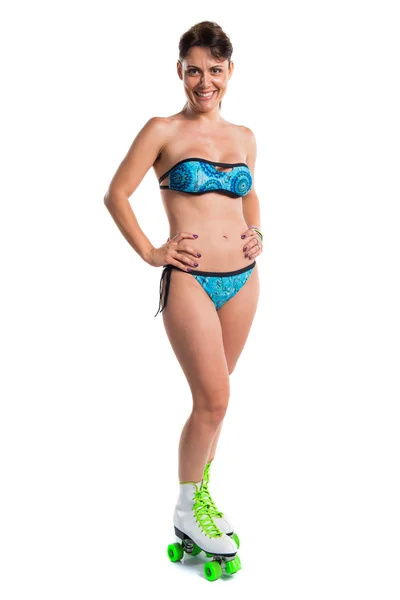 Woman in blue bikini with rollers — Stock Photo, Image