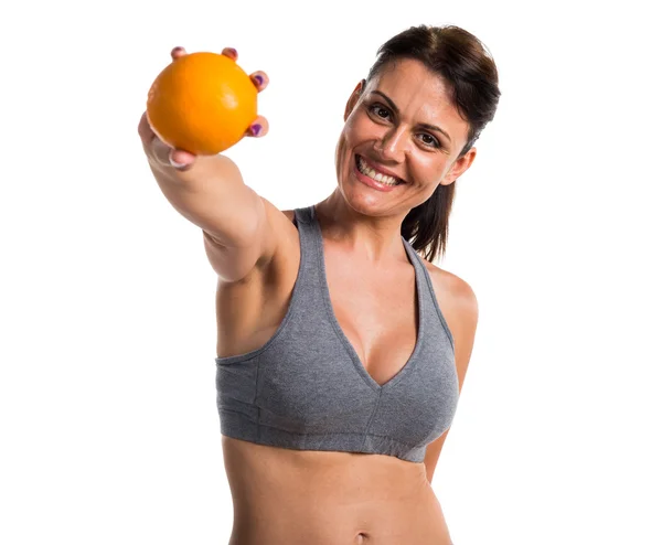 Deporte mujer con una naranja —  Fotos de Stock