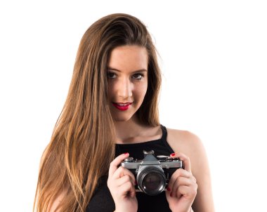 bir kamera tutan genç kız