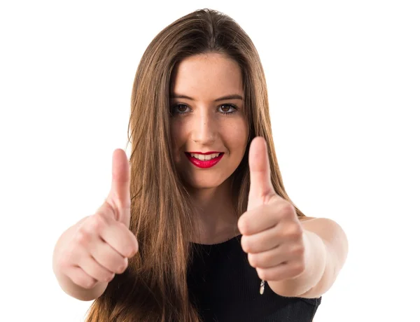 Chica joven con el pulgar hacia arriba — Foto de Stock