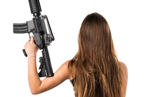 Jovencita sosteniendo un rifle — Foto de Stock