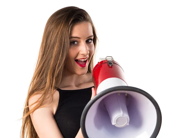 Mladá dívka křičí megafon — Stock fotografie