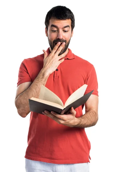 Handsome man reading book — Stock Photo, Image