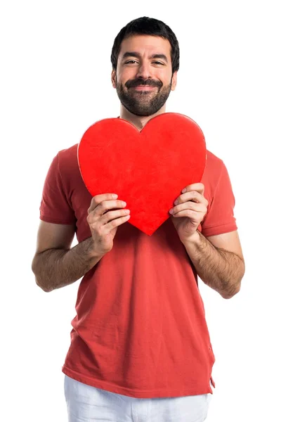 Homem bonito com um ícone de coração — Fotografia de Stock
