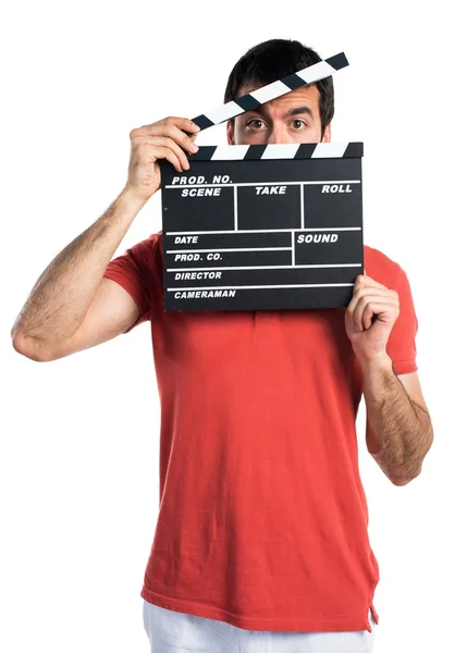 Przystojny mężczyzna trzyma clapperboard — Zdjęcie stockowe