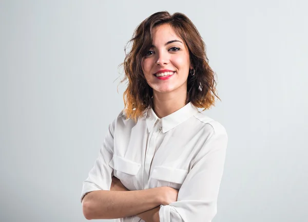 Pretty girl with her arms crossed — Stock Photo, Image