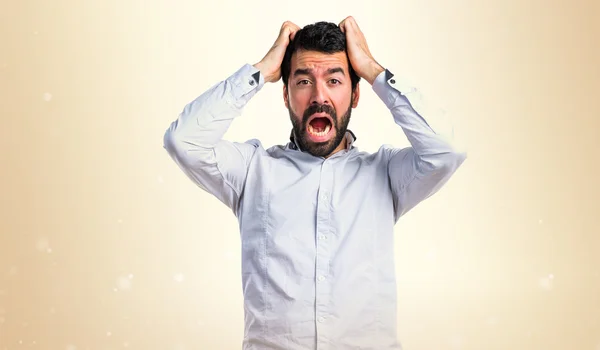 Brunette man over ocher background — Stock Photo, Image