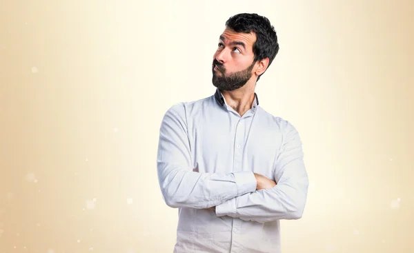 Brunette man over ocher background — Stock Photo, Image