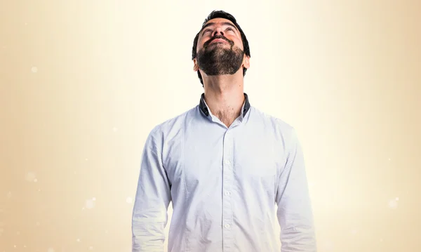 Brunette man over ocher background — Stock Photo, Image