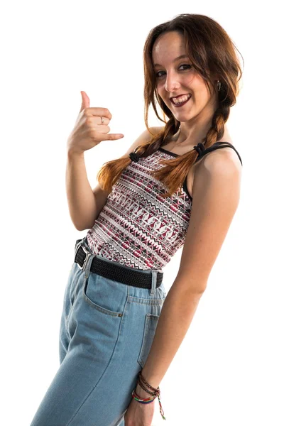 Girl making horn gesture — Stock Photo, Image
