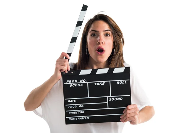Young woman holding a clapperboard — Stock Photo, Image