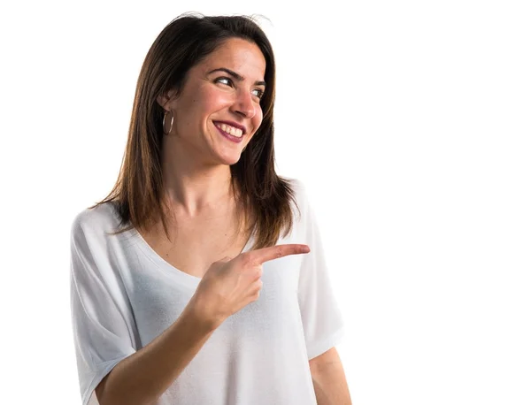 Girl pointing to the lateral — Stock Photo, Image