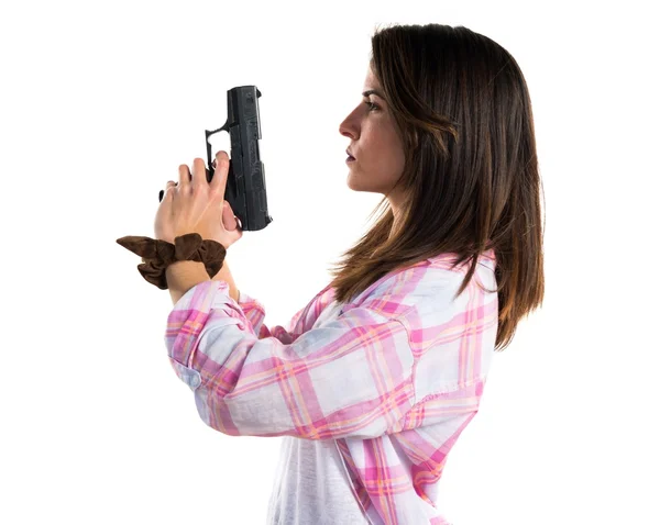 Flicka som håller en pistol — Stockfoto