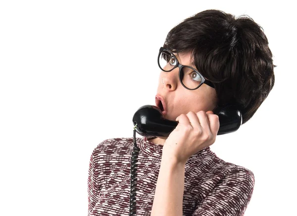 Girl with vintage look talking to vintage phone — Stock Photo, Image