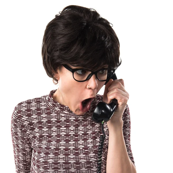 Girl with vintage look talking to vintage phone — Stock Photo, Image