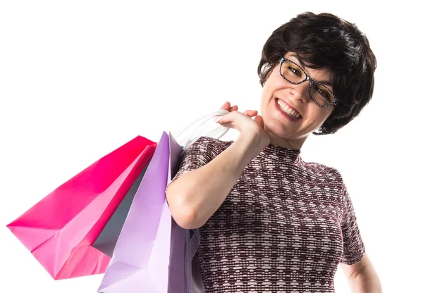 Frau mit vielen Einkaufstüten — Stockfoto