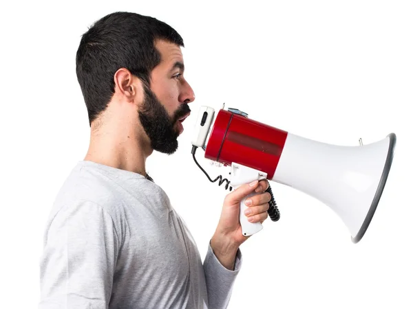 Homem de pijama gritando por megafone — Fotografia de Stock